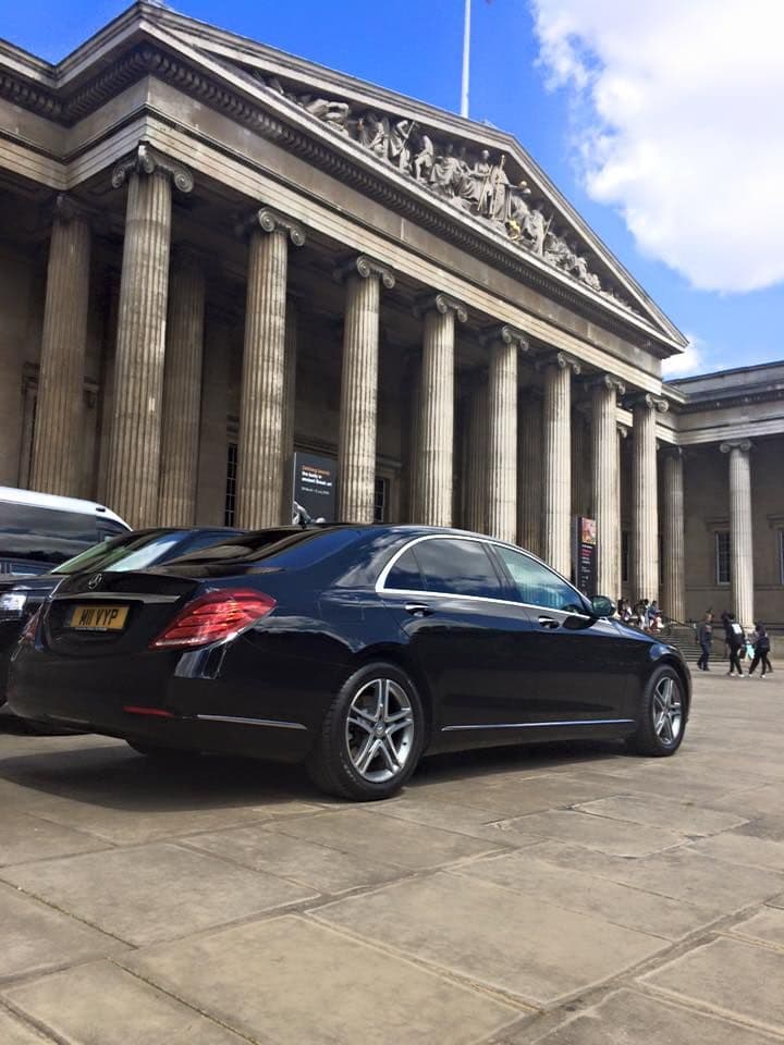 Luxury chauffeur-driven Mercedes-Benz parked in front of a museum in Westminster, London