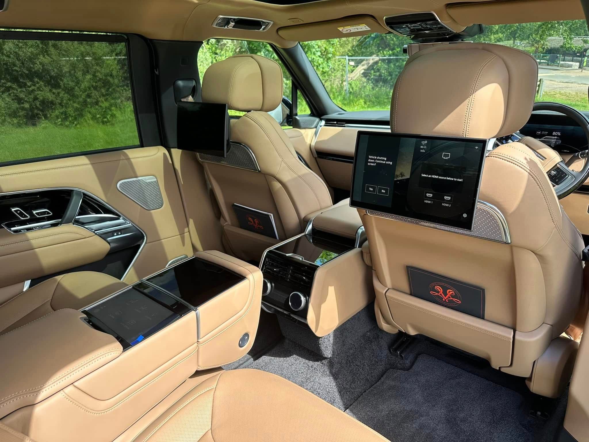Luxury SUV interior prepared for an opera night in London with premium leather seats and ambient lighting