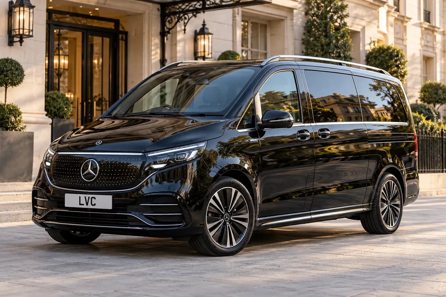 Black Mercedes-Benz EQV outside a luxury hotel