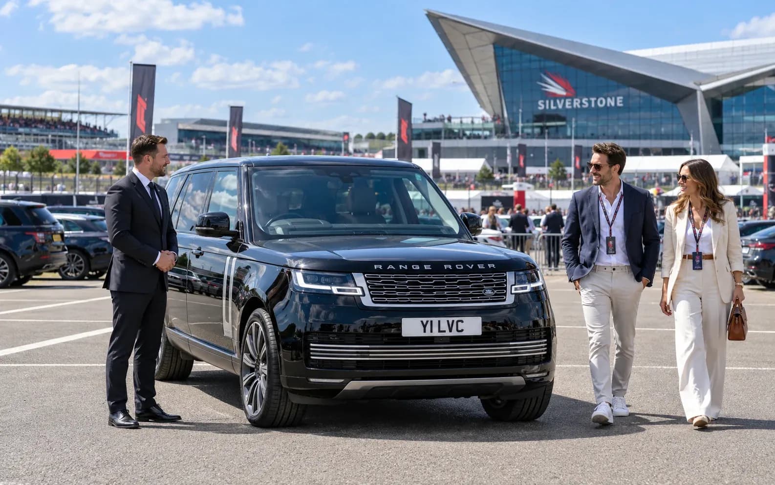 Chauffeur and motorsport guests beside a Range Rover near Silverstone.