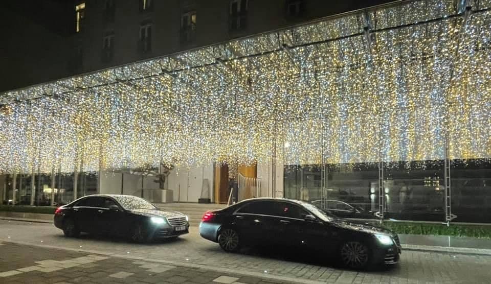 Two luxury chauffeur cars waiting at The Berkeley Hotel to transfer VIP clients to Luton Airport