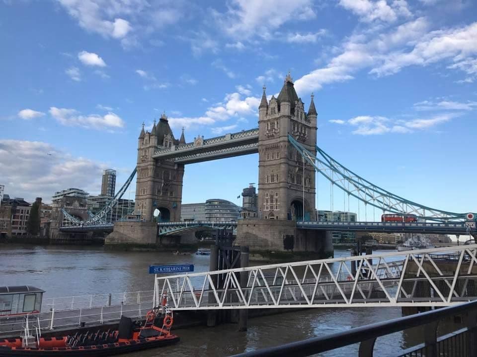 Luxury chauffeur car near a hotel with London Bridge view, ready to transfer VIP clients to the airport