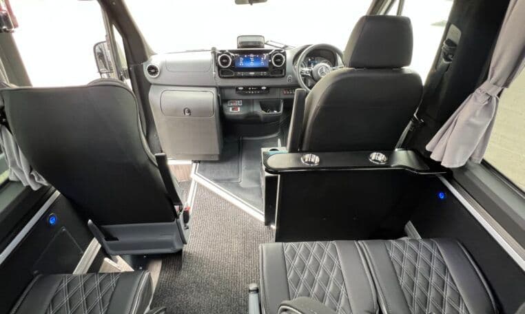 Front interior of the Mercedes-Benz Sprinter Executive Minibus used for luxury group chauffeur transfers and private tours in London.