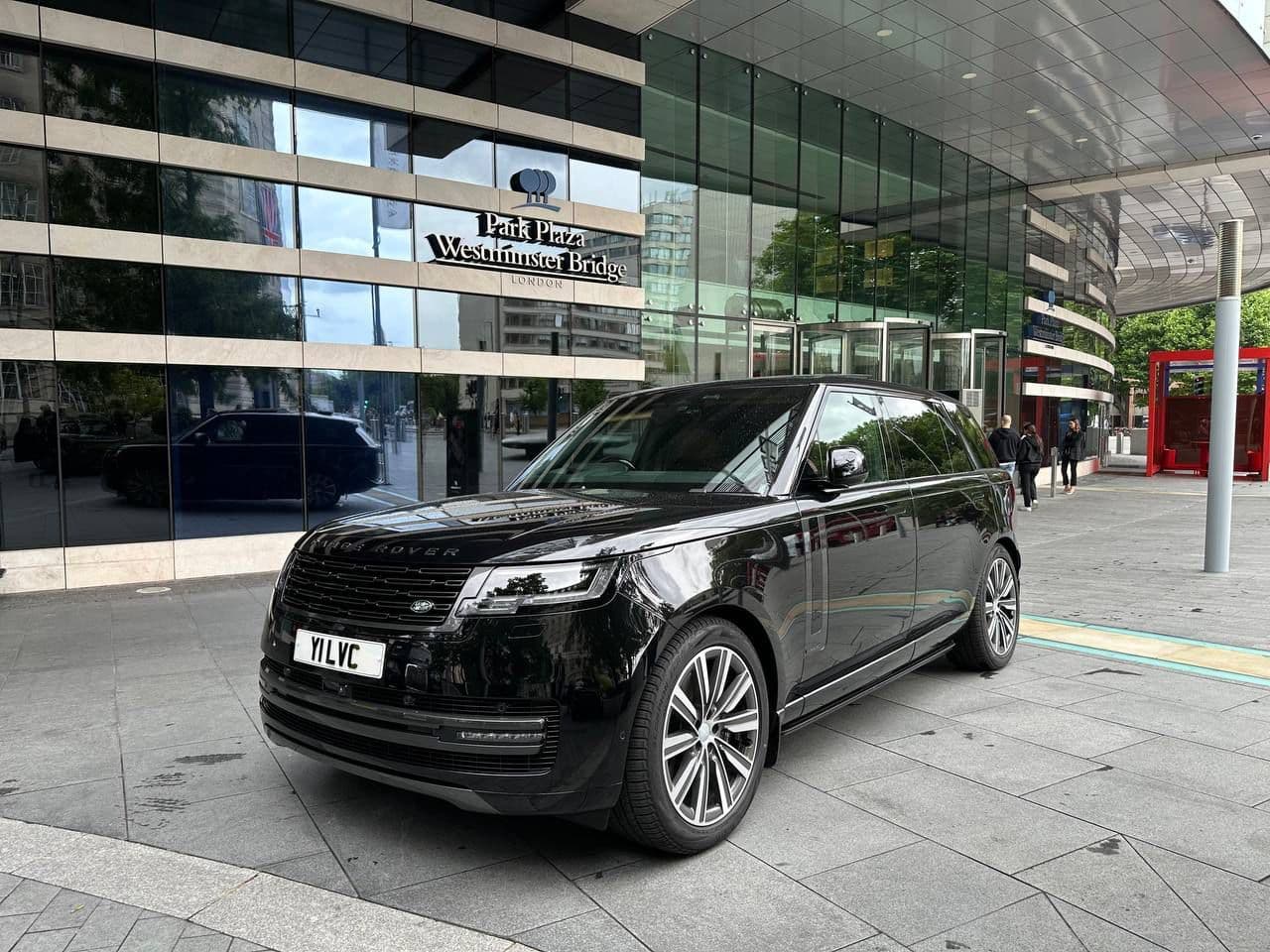 Luxury chauffeur SUV waiting in front of the Westminster Plaza Hotel for airport transfer