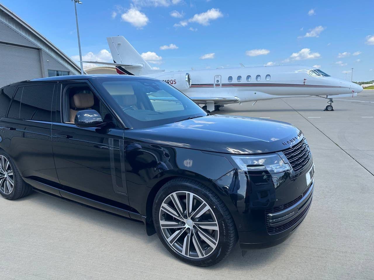 Luxury SUV with corporate clients being picked up from a private jet for a business meeting in the City of London