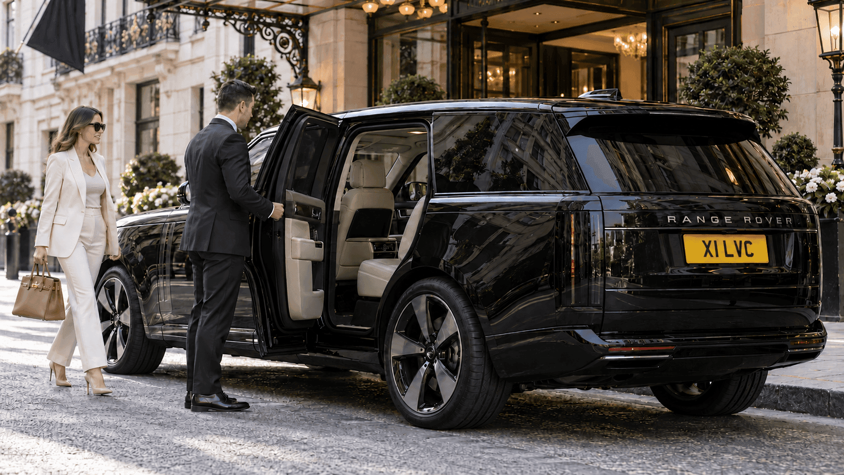 Chauffeur welcoming an executive beside a modern Range Rover Autobiography with X1 LVC registration in Mayfair