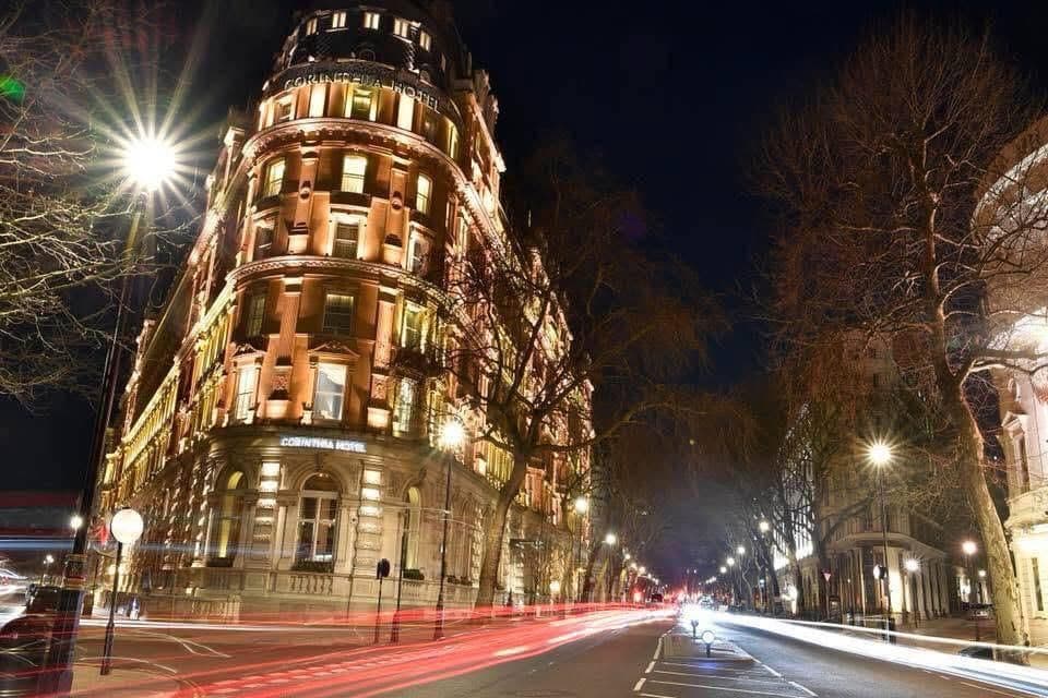 Professional London chauffeur presenting iconic city landmarks to clients during a private sightseeing tour