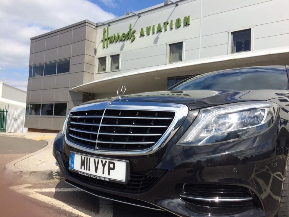 Luxury Mercedes S-Class chauffeur car waiting at Harrods Aviation to collect a diplomatic delegation