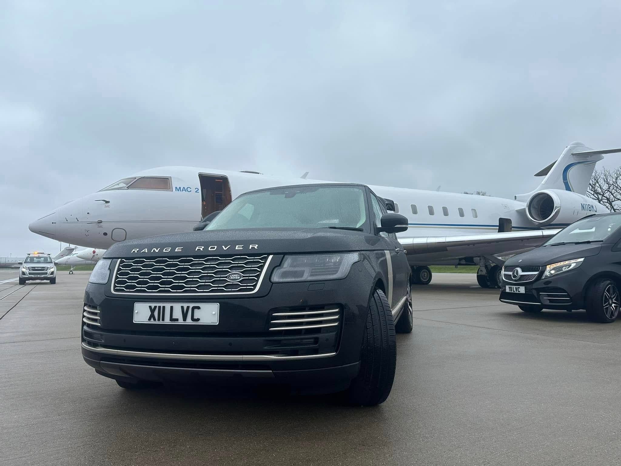 Luxury SUV and Mercedes-Benz V-Class chauffeur vehicles waiting beside a private jet for VIP guests in London.