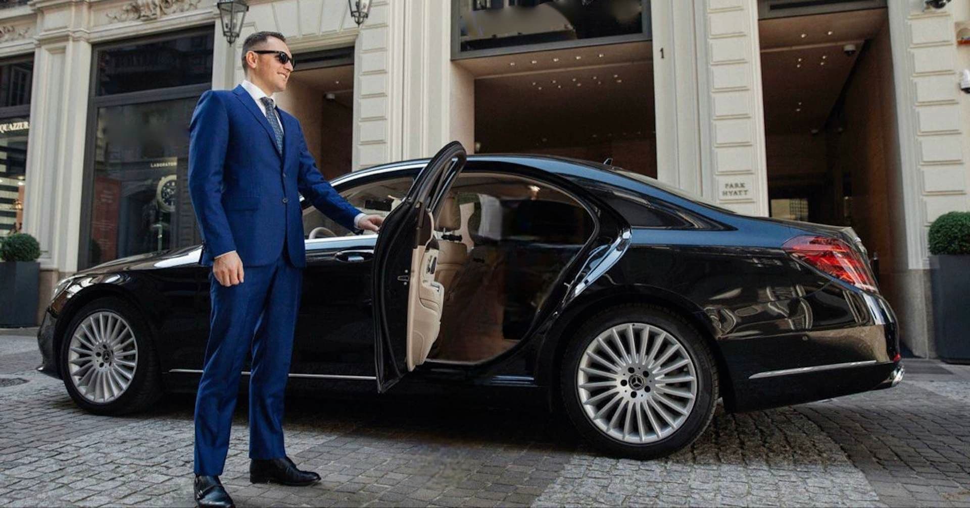Mercedes-Benz S-Class with professional chauffeur waiting for VIP guest in London