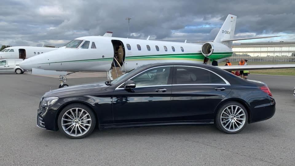 Mercedes-Benz S-Class parked near a private jet ready for VIP clients in London