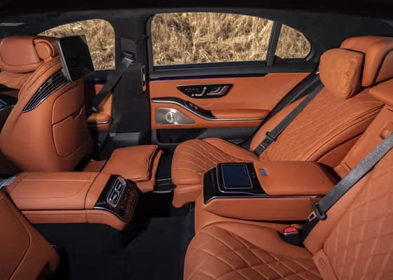 Luxury brown leather recline seats interior for VIP chauffeur service in Mayfair London