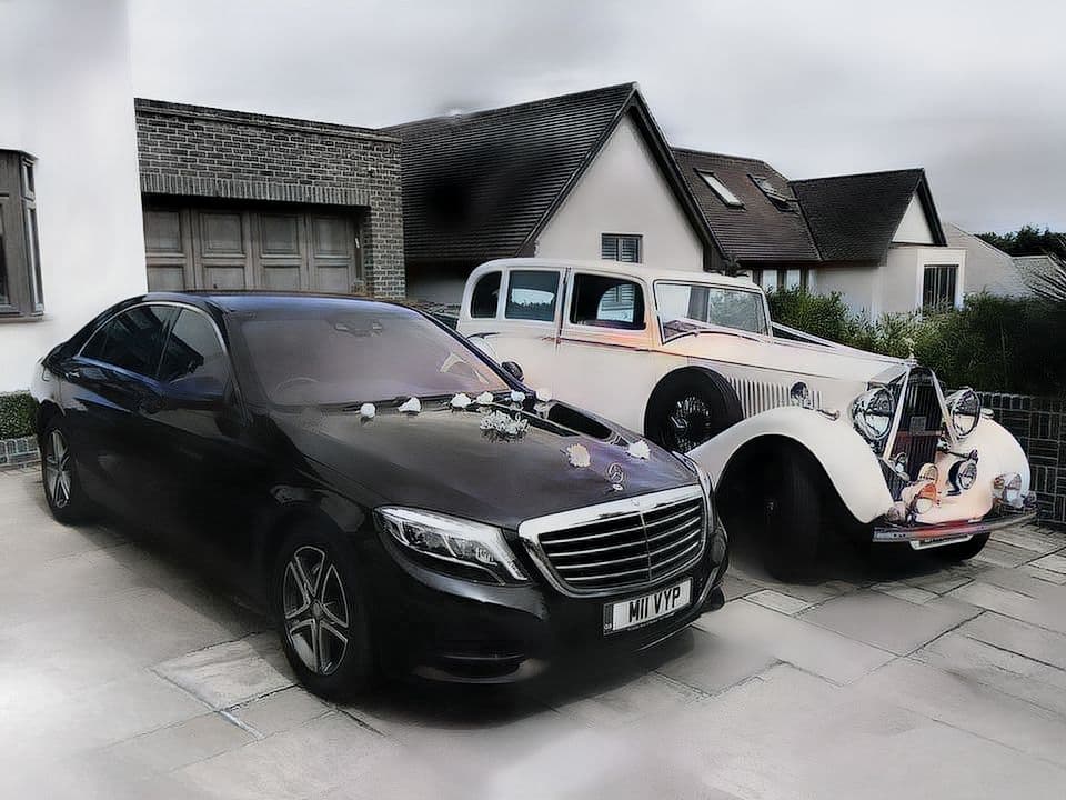 Luxury wedding chauffeur service with a Mercedes S-Class decorated with flowers and a vintage Mercedes wedding car in London.