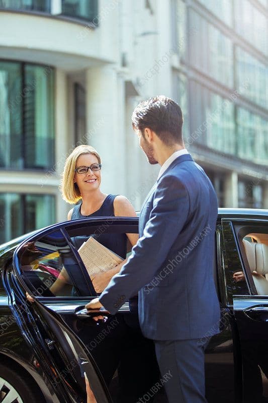 Lady getting into a chauffeur-driven luxury car for the Wimbledon tennis tournament in London